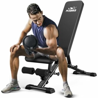 Man using Flybird adjustable weight bench for bicep curls.