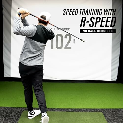 Person practicing golf swing with R-Speed training tool indoors.