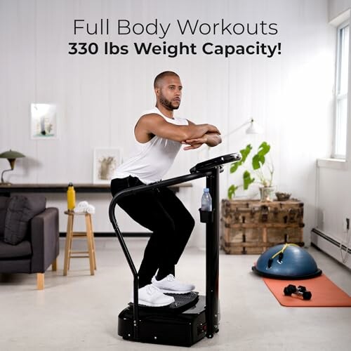 Man performing full body workout on vibration platform in living room.