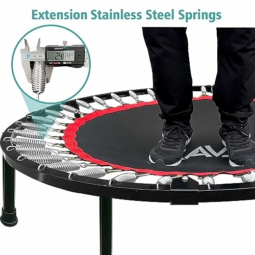 Person standing on trampoline with stainless steel springs and caliper measurement.