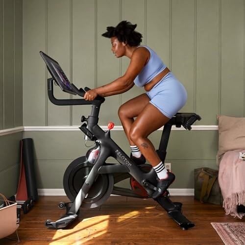 Woman exercising on a stationary bike in a home setting