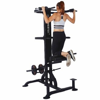 Woman exercising on a power tower with weights