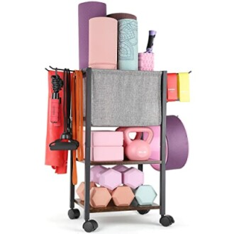 Yoga equipment storage rack with mats, weights, and accessories.